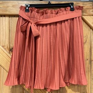 Ruffle skirt in light orange with tie